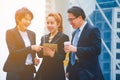 Businessman and team work.She play smart phone and talking on walkway.He holding coffee cup and talking Business. Royalty Free Stock Photo