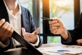 Businessman team working at office desk and using a digital comp Royalty Free Stock Photo