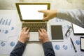 Businessman team working at office desk and using a digital touch screen tablet hands detail, computer and objects on