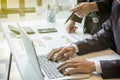 Businessman team working at office desk and using a digital touch screen tablet hands detail, computer and objects on the table i