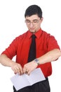 Businessman tear to pieces sheets of paper