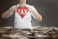 Businessman tearing his shirt showing Tax text on his chest Royalty Free Stock Photo