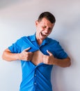 Businessman tearing off his shirt and showing mucular body concept on background Royalty Free Stock Photo