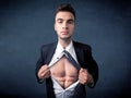 Businessman tearing off shirt and showing mucular body Royalty Free Stock Photo