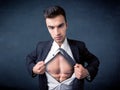 Businessman tearing off shirt and showing mucular body Royalty Free Stock Photo