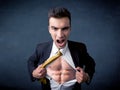 Businessman tearing off shirt and showing mucular body Royalty Free Stock Photo