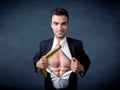 Businessman tearing off shirt and showing mucular body Royalty Free Stock Photo