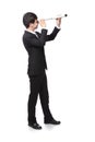 Businessman with telescope looking forward Royalty Free Stock Photo