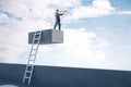 Businessman with telescope standing on concrete cube with ladder