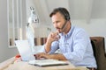 Businessman teleworking on laptop Royalty Free Stock Photo