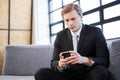 Businessman text messaging on mobile phone Royalty Free Stock Photo