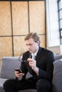 Businessman text messaging on mobile phone Royalty Free Stock Photo