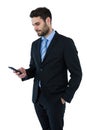 Businessman text messaging on mobile phone Royalty Free Stock Photo