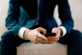 Businessman texting on the couch Royalty Free Stock Photo