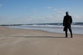 Businessman thinking on the beach