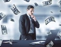 Businessman thinking and falling dollar bills Royalty Free Stock Photo