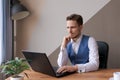 Businessman thinking about online project, looking at laptop at workplace Royalty Free Stock Photo