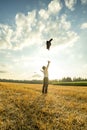 Businessman Throwing Coat in the Air at the Field