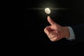 Businessman throwing coin on black background. Space for text