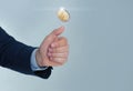 Businessman throwing coin on color background Royalty Free Stock Photo