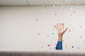 Businessman throwing confetti in the air