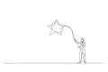 businessman throws a lasso, catching star