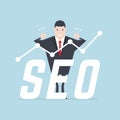 Businessman thumbs up with SEO text and growth graph.
