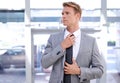 Businessman, tie and suit at office for fashion, style or attire in corporate building. Handsome, young or attractive Royalty Free Stock Photo
