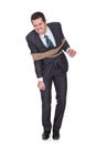 Businessman tied up in rope Royalty Free Stock Photo