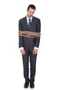 Businessman tied up in rope