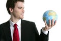 Businessman tien suit with world ball map in hand Royalty Free Stock Photo