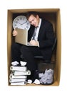 Businessman in a tight office Royalty Free Stock Photo
