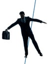 Businessman tightrope walker silhouette Royalty Free Stock Photo