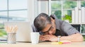 Businessman tired overworked he sleeping over a laptop computer Royalty Free Stock Photo