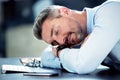 Businessman, tired and sleeping with desk in office with exhausted from overworked in company. Corporate, closeup and Royalty Free Stock Photo