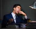 Businessman tired and sleeping in the office after overtime hour Royalty Free Stock Photo