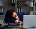 Businessman tired and sleeping in the office after overtime hour Royalty Free Stock Photo