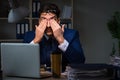 The businessman tired and sleeping in the office after overtime hours Royalty Free Stock Photo