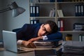 The businessman tired and sleeping in the office after overtime hours Royalty Free Stock Photo