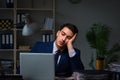 The businessman tired and sleeping in the office after overtime hours Royalty Free Stock Photo