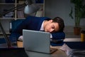 The businessman tired and sleeping in the office after overtime hours Royalty Free Stock Photo