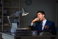 The businessman tired and sleeping in the office after overtime hours Royalty Free Stock Photo