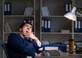 Businessman tired and sleeping in the office after overtime hour Royalty Free Stock Photo