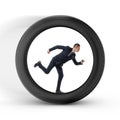 Businessman to be pressed for time is running in the center of a big wheel Royalty Free Stock Photo