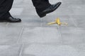 Businessman stepping on a banana skin, peel, work accident, copy space Royalty Free Stock Photo