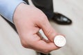 Businessman tossing a coin Royalty Free Stock Photo