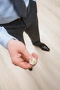 Businessman tossing a coin Royalty Free Stock Photo