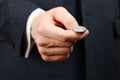 Businessman tossing a coin. Heads or tails. Close up Royalty Free Stock Photo