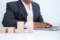 Businessman touches the woodblocks placed on the  table Royalty Free Stock Photo