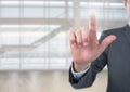 Businessman touching air in front of glass room Royalty Free Stock Photo
